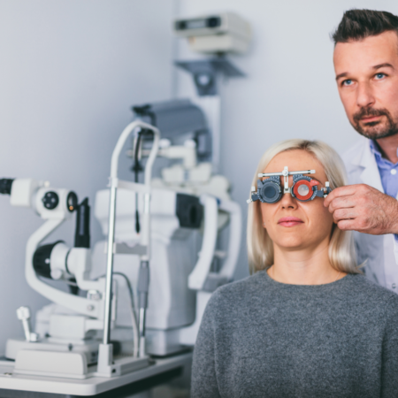 Opticians in room eye testing